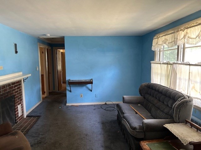 28 Martin Road Reading, MA 01867 - Photo 7 of 19 a living room with furniture and a window