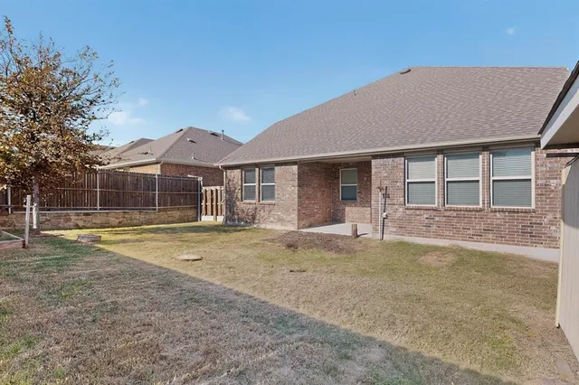 an aerial view of a house with a swimming pool