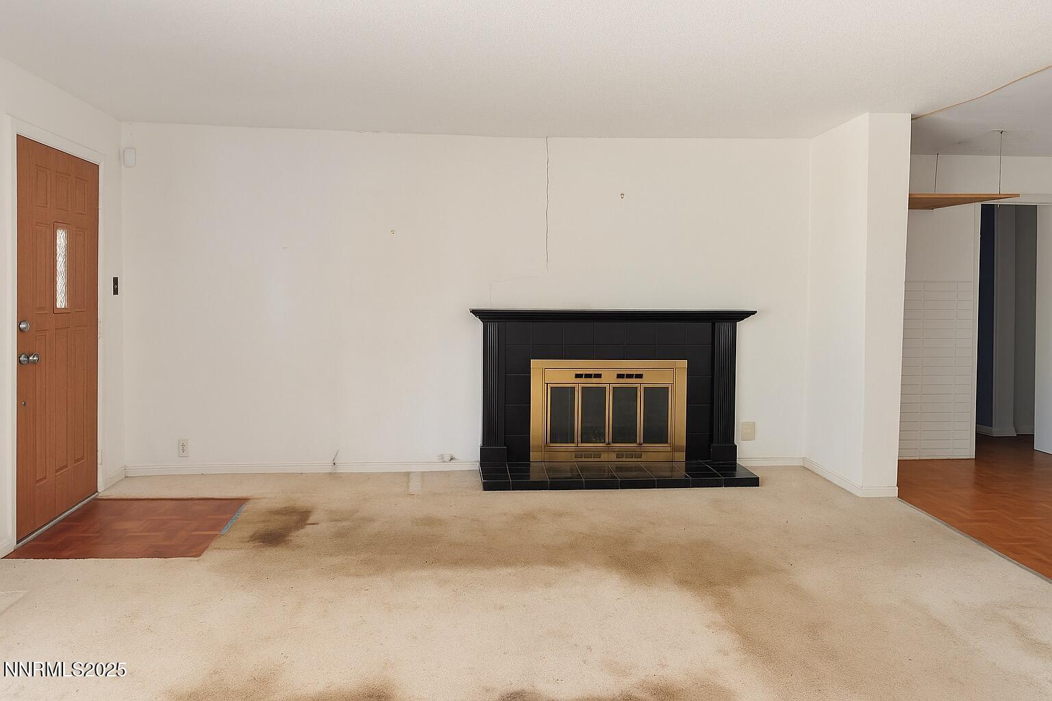 302 Griffin Court Stateline, NV 89449 - Photo 2 of 10 a view of an empty room with a fireplace