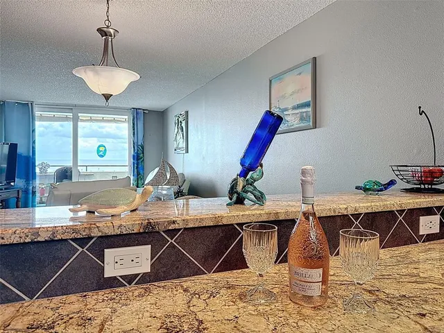 a view of a balcony with furniture and city view