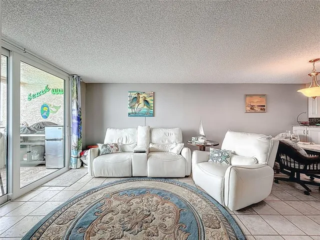 a en suite bathroom with a granite countertop sink and a mirror