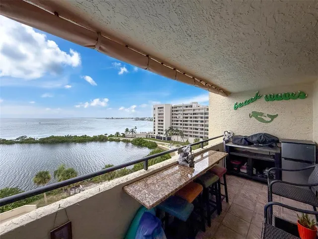 a bed room with a bed and a chandelier