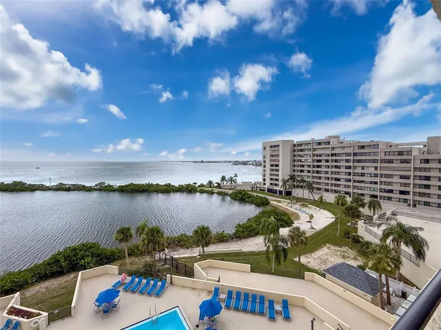a living room with furniture and a chair