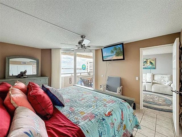 a bathroom with a granite countertop toilet sink and mirror