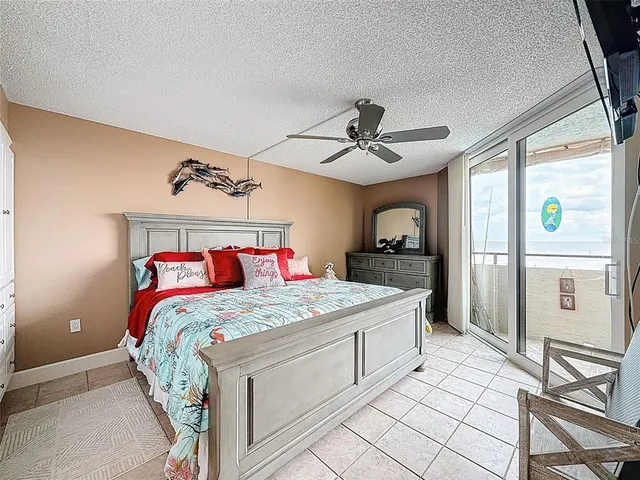 a view of a bedroom with washer and dryer
