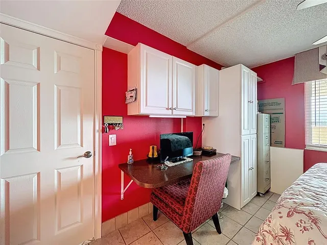 a view of a city from a dining room with large windows