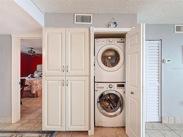 a view of a hallway with white doors