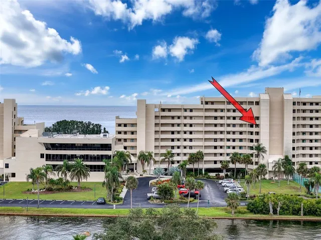 a view of a garage with a bike and white car