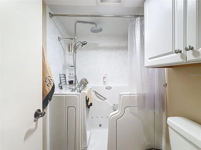 a kitchen with a stove a sink and a refrigerator