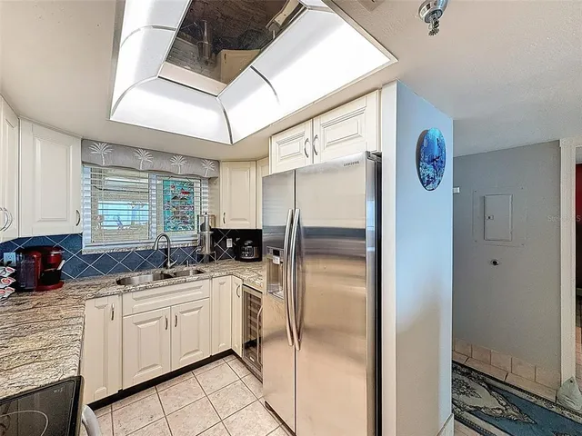 a living room with furniture a table and a chandelier