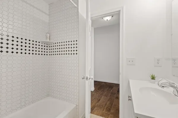 a bathroom with a bathtub and shower