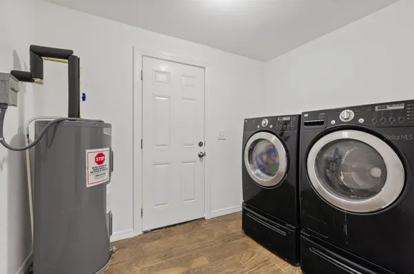 a view of storage and utility room with washer and dryer