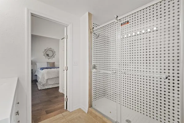 a bathroom with a bathtub and shower