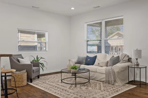 a living room with furniture and a window