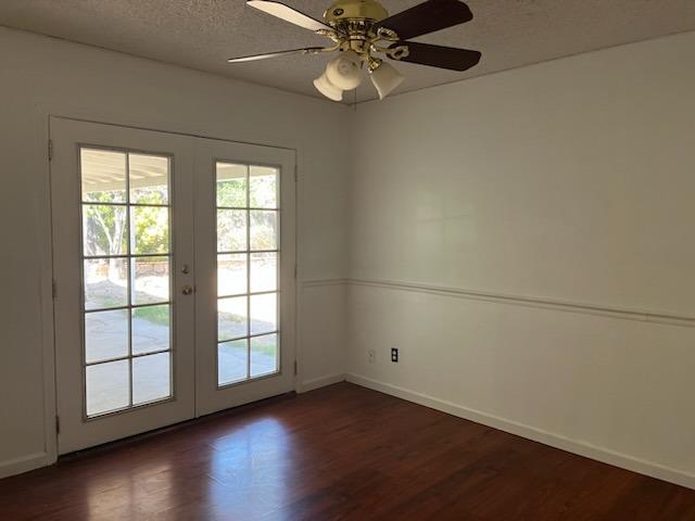 3065 Anderson Avenue Clovis, CA 93612 - Photo 12 of 16 an empty room with wooden floor fan and windows