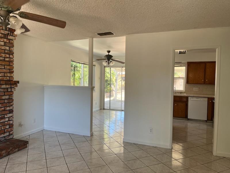 3065 Anderson Avenue Clovis, CA 93612 - Photo 4 of 16 a view of a kitchen with a sink and an oven in a room