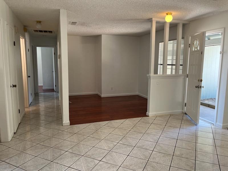 3065 Anderson Avenue Clovis, CA 93612 - Photo 5 of 16 wooden floor with a bathroom and a mirror