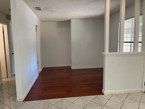 3065 Anderson Avenue Clovis, CA 93612 - Photo 8 of 16 an empty room with wooden floor and windows