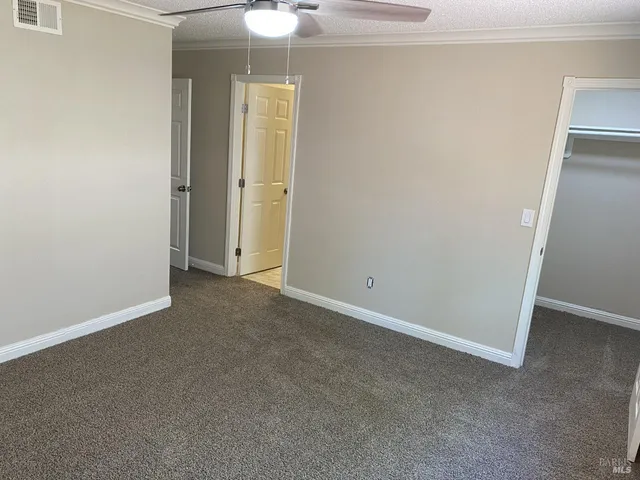 an empty room with a bathroom