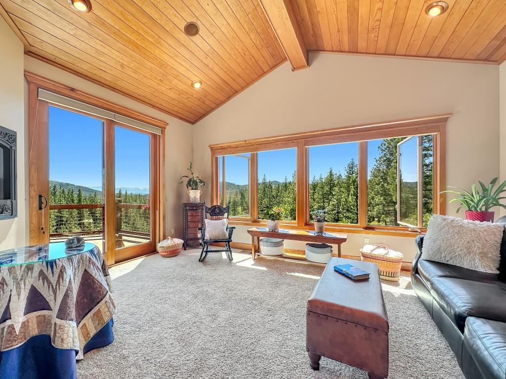 1947 Grizzly Ranch Road Portola, CA 96122 - Photo 12 of 25 a living room with furniture and floor to ceiling windows