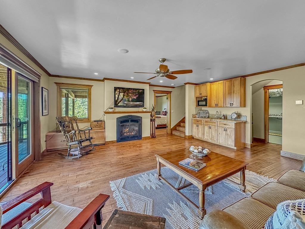 1947 Grizzly Ranch Road Portola, CA 96122 - Photo 16 of 25 a living room with furniture and a fireplace