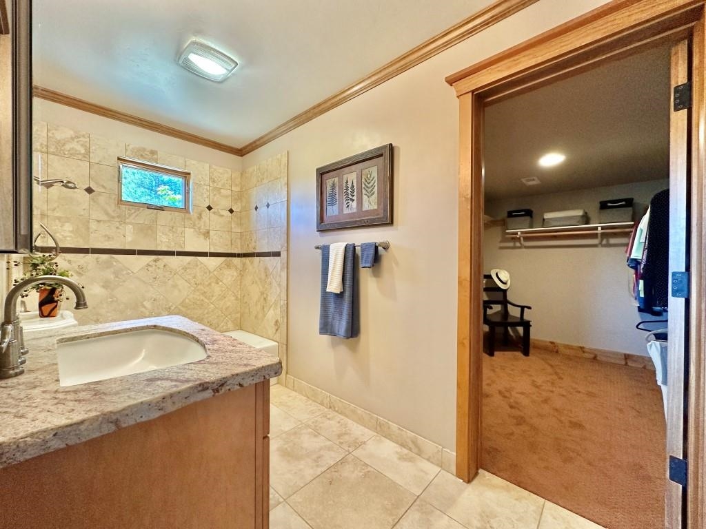 1947 Grizzly Ranch Road Portola, CA 96122 - Photo 17 of 25 a bathroom with a sink and a mirror