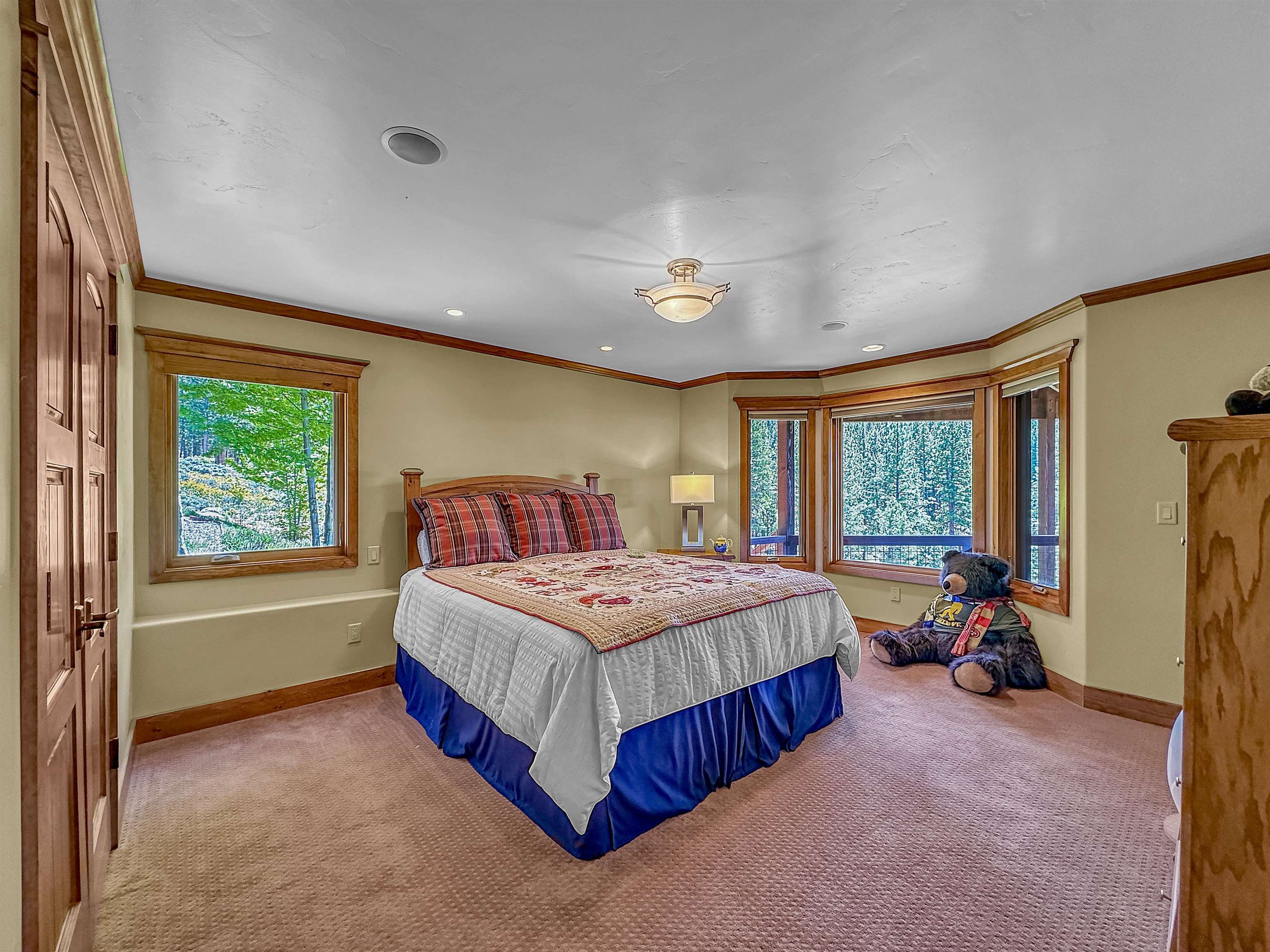 1947 Grizzly Ranch Road Portola, CA 96122 - Photo 18 of 25 a bedroom with a bed and a large window