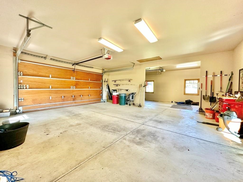 1947 Grizzly Ranch Road Portola, CA 96122 - Photo 20 of 25 a bedroom with a bed and cabinets