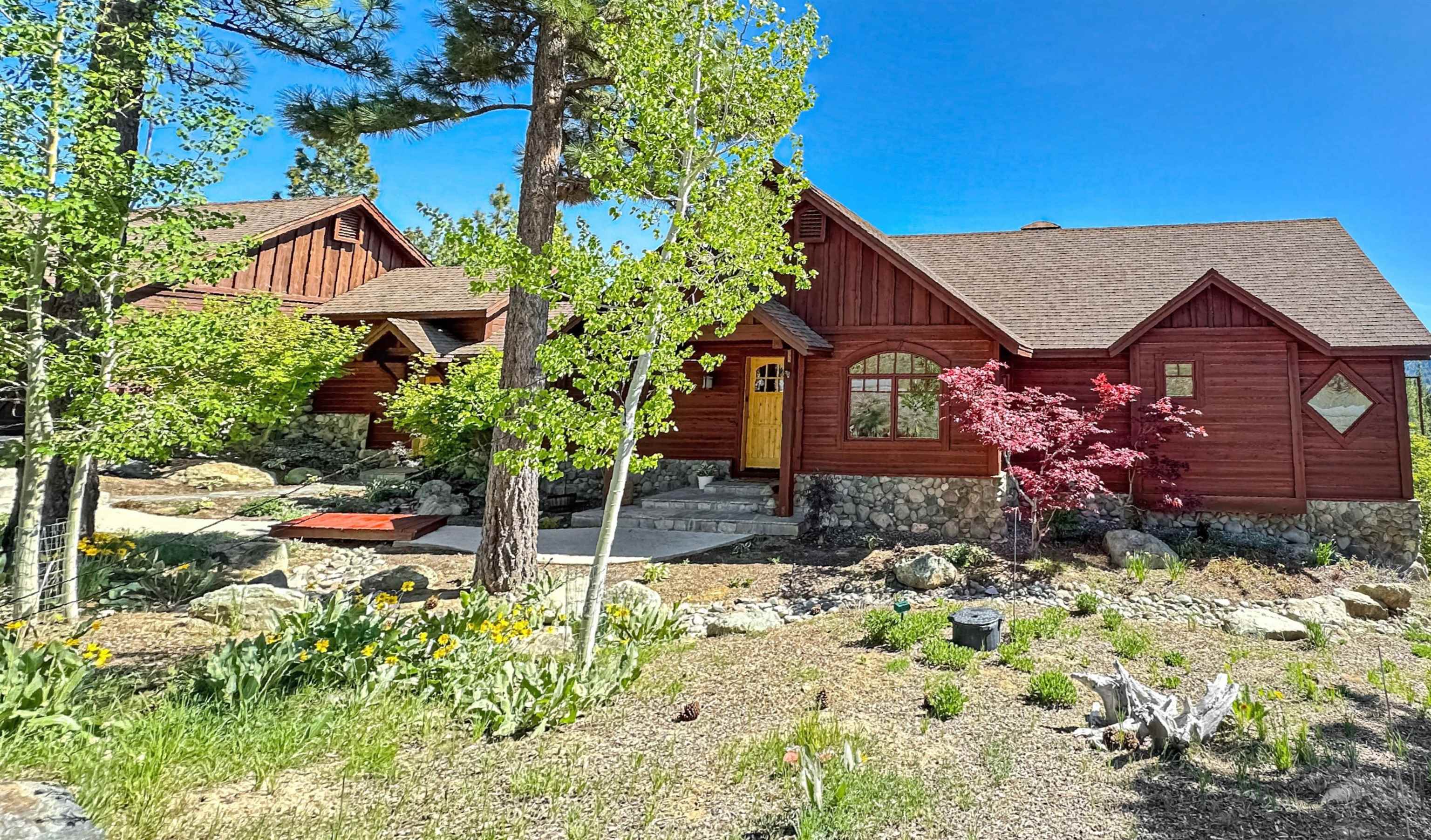 1947 Grizzly Ranch Road Portola, CA 96122 - Photo 2 of 25 a view of house with yard and sitting area