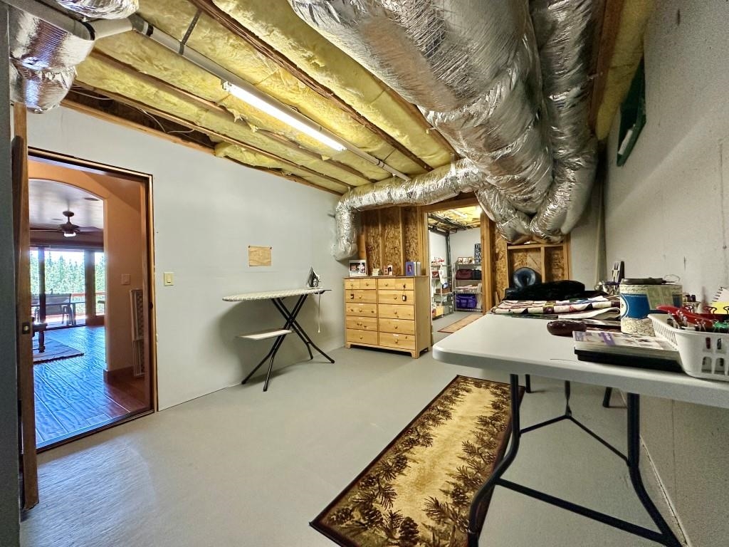 1947 Grizzly Ranch Road Portola, CA 96122 - Photo 21 of 25 a room with furniture and wooden floor