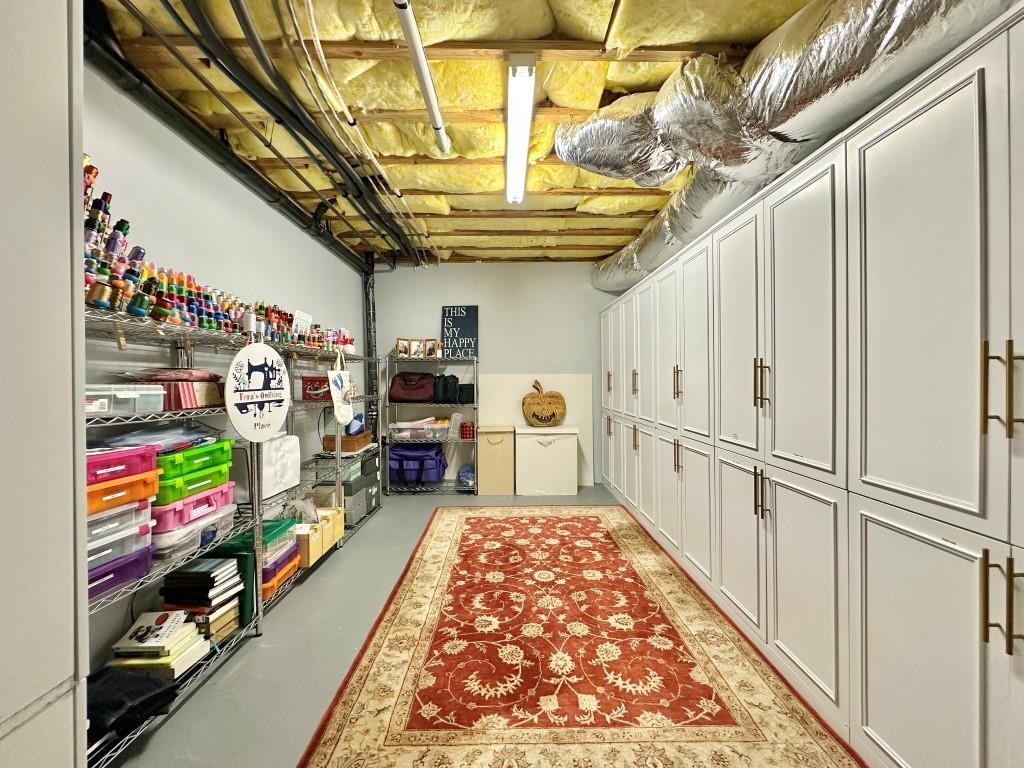 1947 Grizzly Ranch Road Portola, CA 96122 - Photo 22 of 25 a utility room with lots of clutter and washer