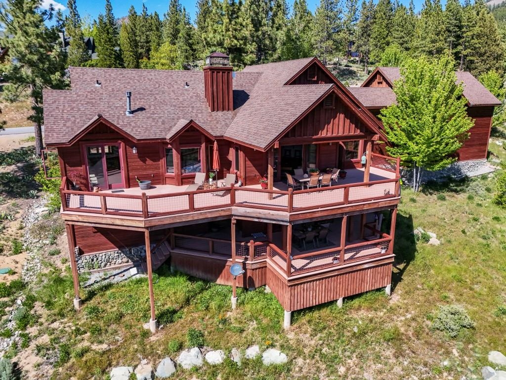 1947 Grizzly Ranch Road Portola, CA 96122 - Photo 25 of 25 an aerial view of a house with a deck and a yard