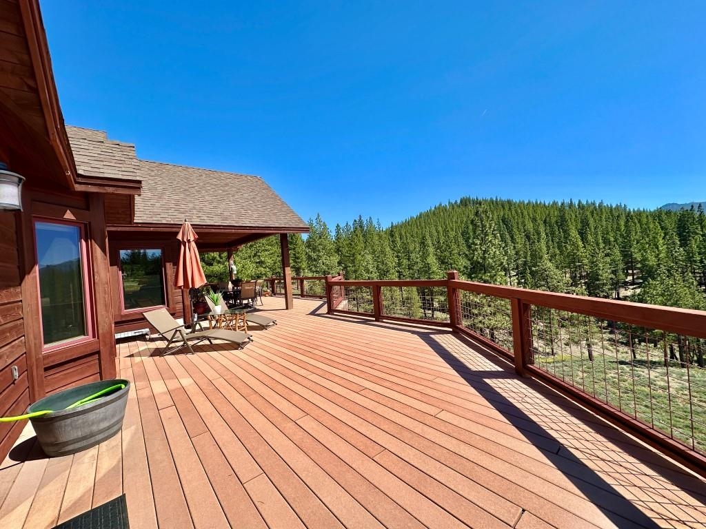1947 Grizzly Ranch Road Portola, CA 96122 - Photo 4 of 25 a view of a chairs and table on the wooden floor