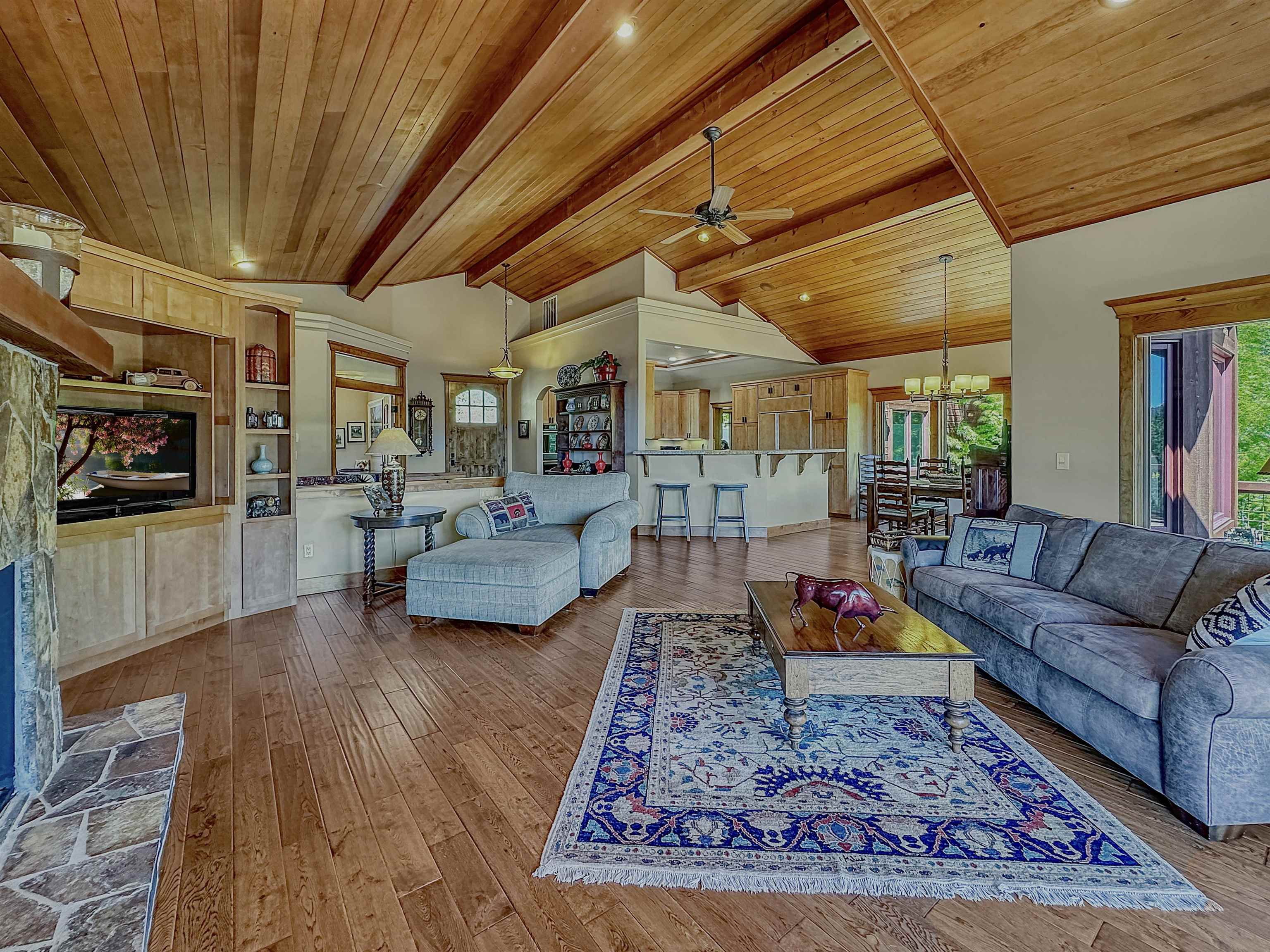 1947 Grizzly Ranch Road Portola, CA 96122 - Photo 6 of 25 a living room with furniture and a flat screen tv
