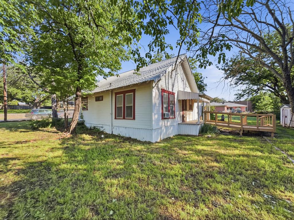 908 South Rice Street Hamilton, TX 76531 - Photo 3 of 13 a view of a house with a yard