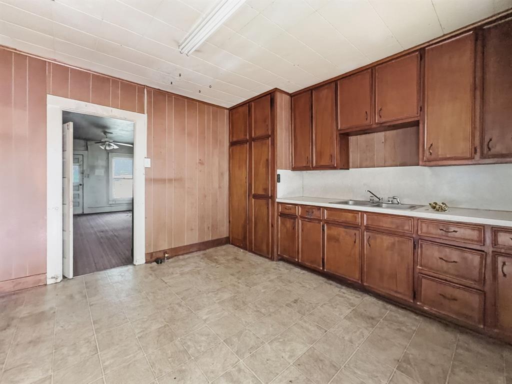 908 South Rice Street Hamilton, TX 76531 - Photo 7 of 13 a view of a kitchen with cabinets