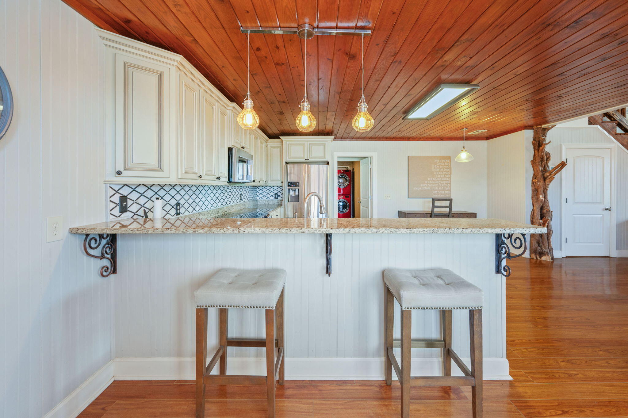 126 Tall Oaks Road DeFuniak Springs, FL 32435 - Photo 14 of 50 a kitchen with stainless steel appliances granite countertop a chairs a sink and a refrigerator