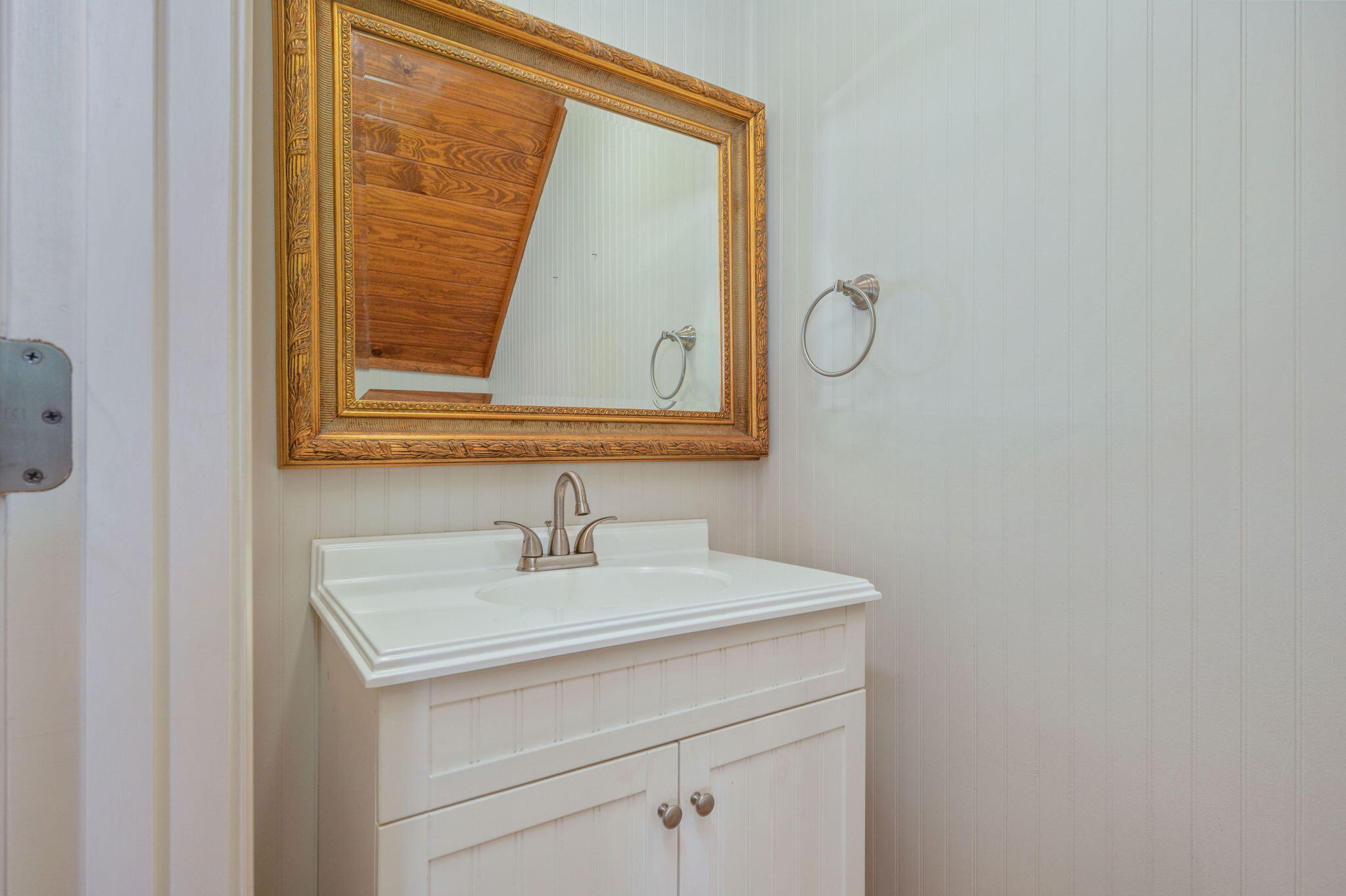 126 Tall Oaks Road DeFuniak Springs, FL 32435 - Photo 23 of 50 a bathroom with a sink and a mirror