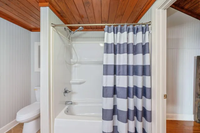 a view of a storage & utility room with dryer and washer