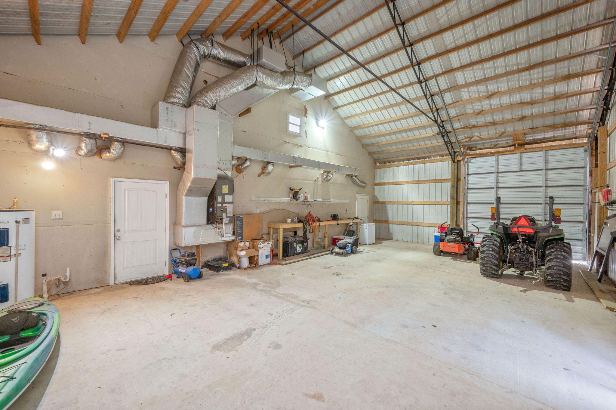 126 Tall Oaks Road DeFuniak Springs, FL 32435 - Photo 34 of 50 a view of a garage with a bike and car