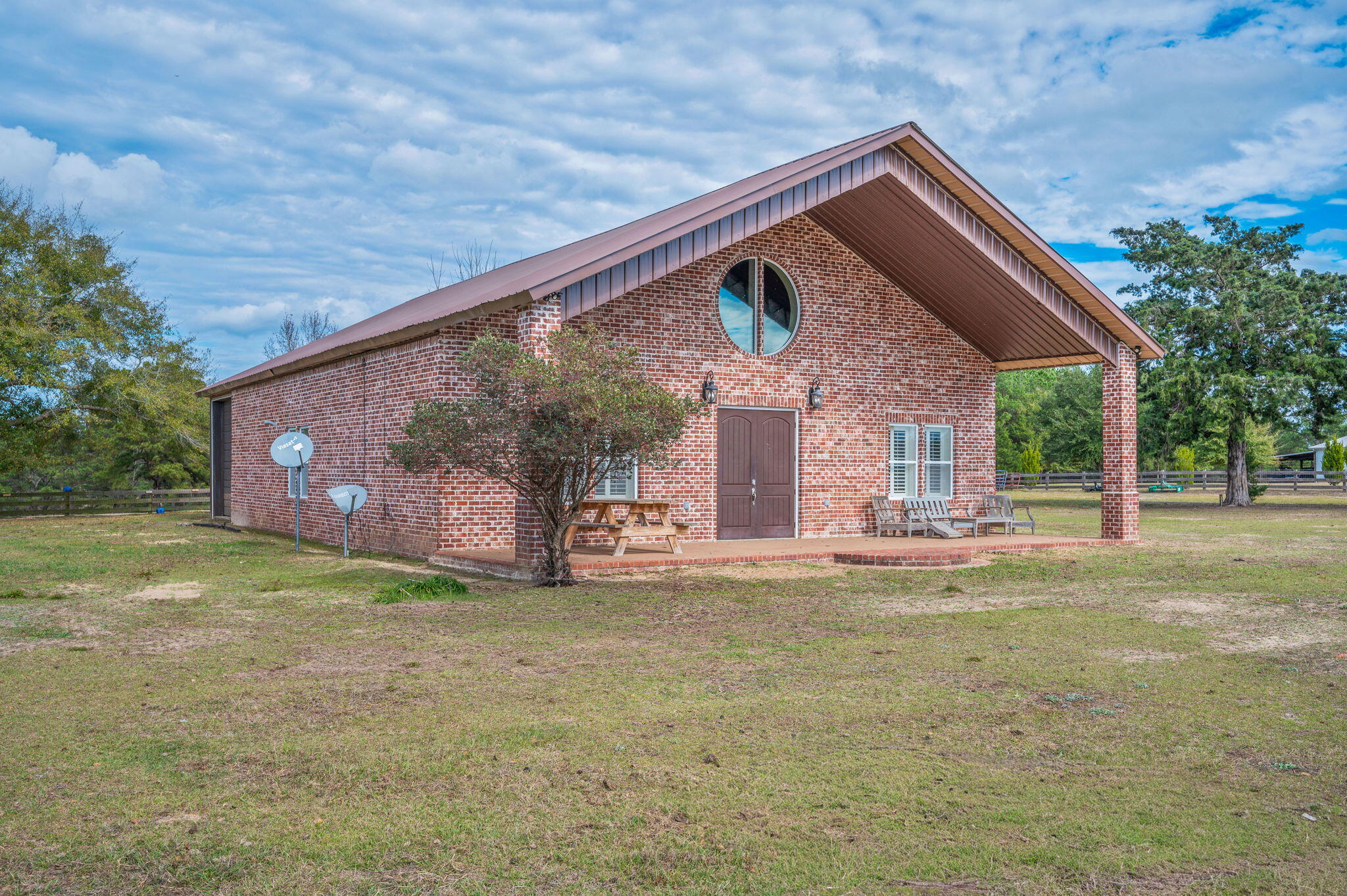 126 Tall Oaks Road DeFuniak Springs, FL 32435 - Photo 6 of 50 a view of a house with a yard and a patio