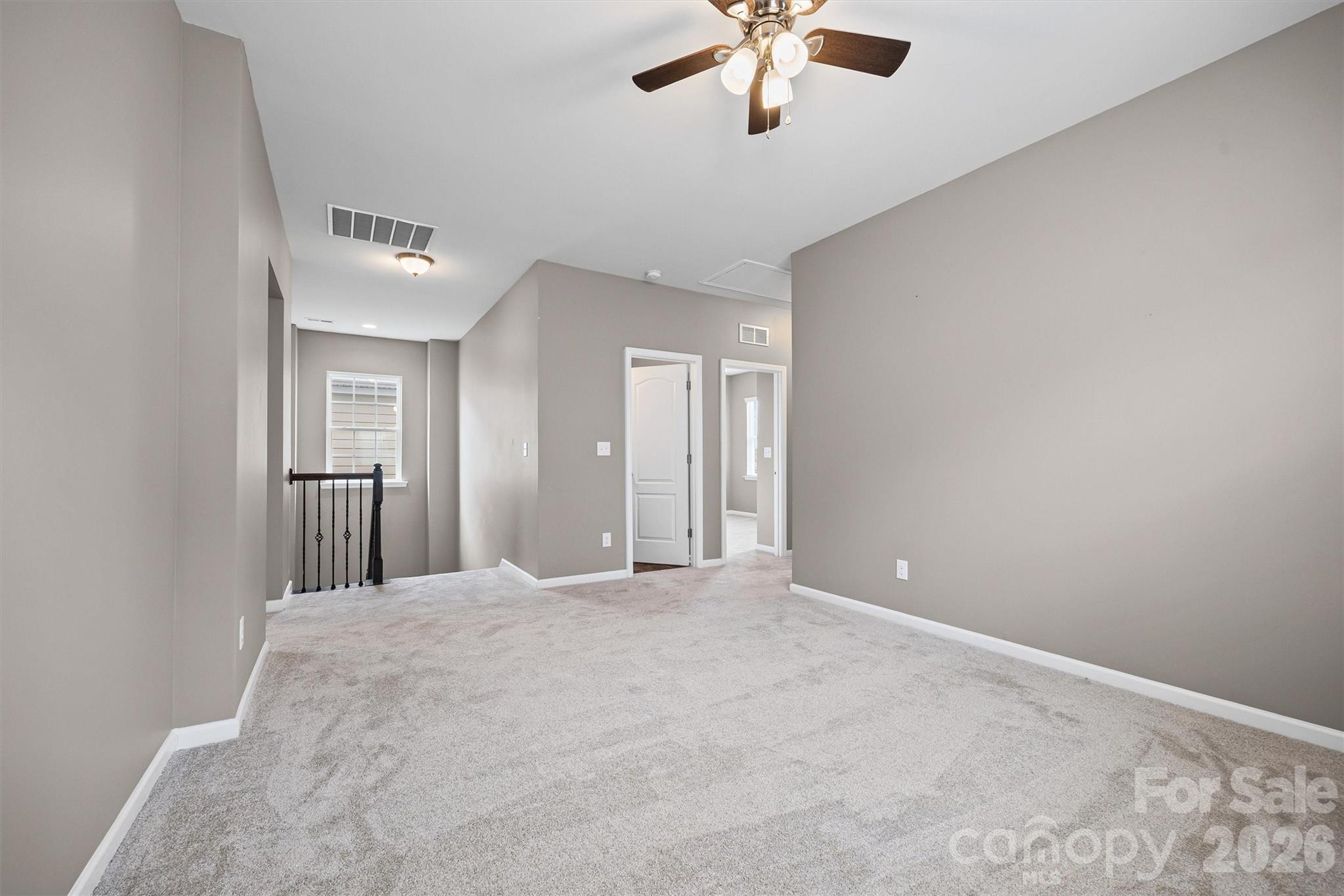 6179 Cloverdale Drive Fort Mill, SC 29708 - Photo 23 of 39 a view of an empty room with a chandelier fan