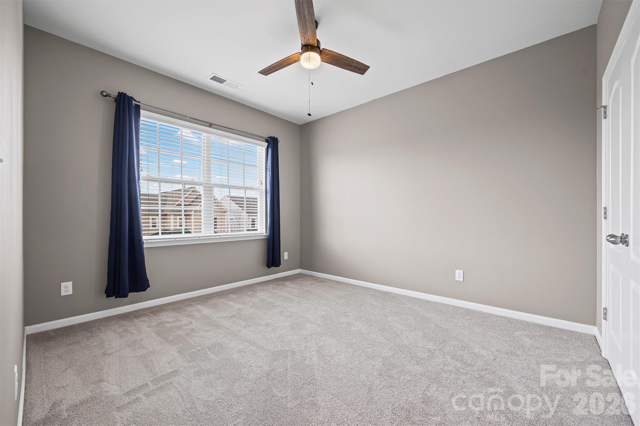 6179 Cloverdale Drive Fort Mill, SC 29708 - Photo 24 of 39 a view of an empty room with a window