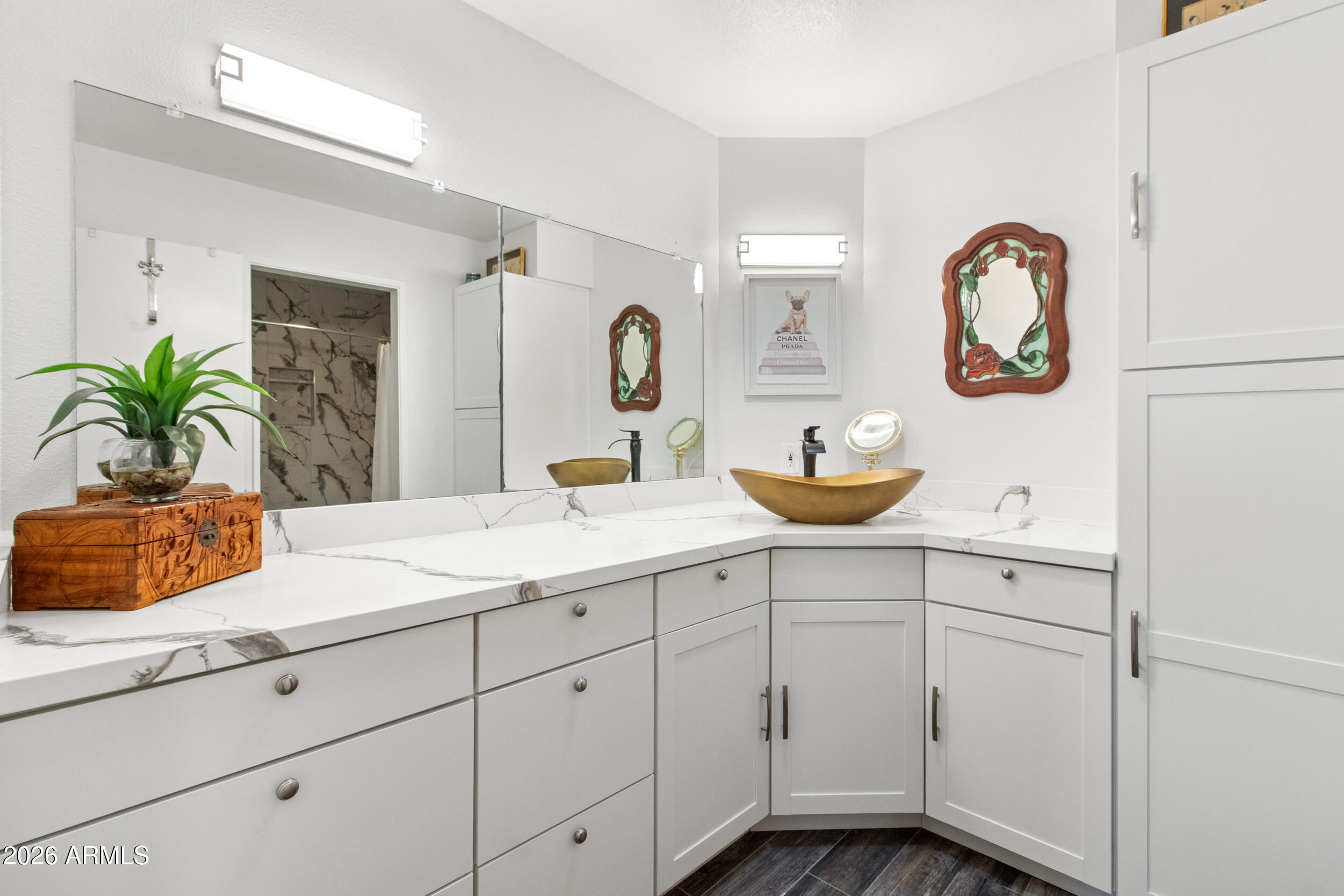 9801 West Pleasant Valley Road Sun City, AZ 85351 - Photo 15 of 26 a bathroom with a sink and a mirror