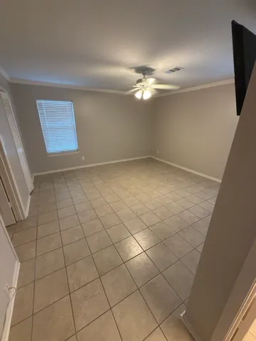 a spacious bathroom with a granite countertop sink a mirror and a bathtub