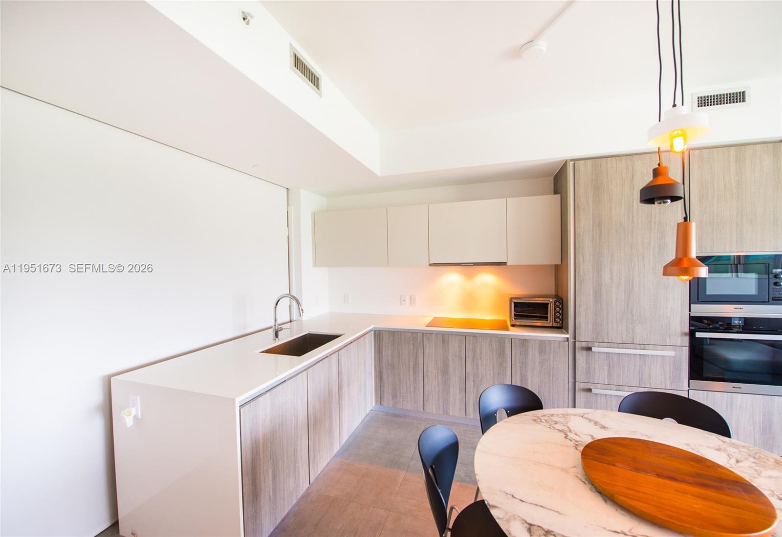 2900 Northeast 7th Avenue, Unit 1903 Miami, FL 33137 - Photo 12 of 43 a bathroom with a sink and a mirror
