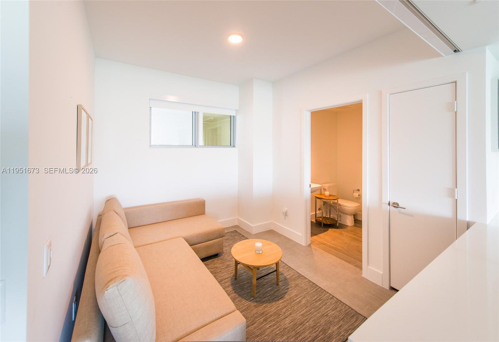 2900 Northeast 7th Avenue, Unit 1903 Miami, FL 33137 - Photo 13 of 43 a living room with furniture and a large window