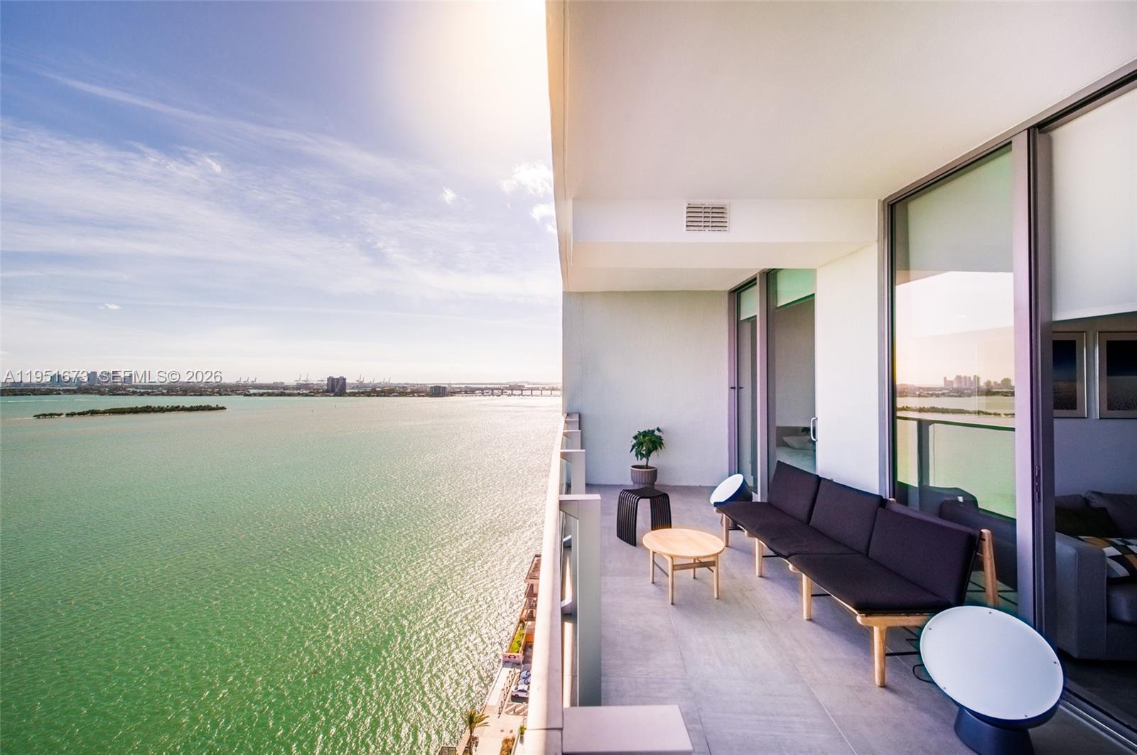 2900 Northeast 7th Avenue, Unit 1903 Miami, FL 33137 - Photo 16 of 43 a living room with furniture and a floor to ceiling window