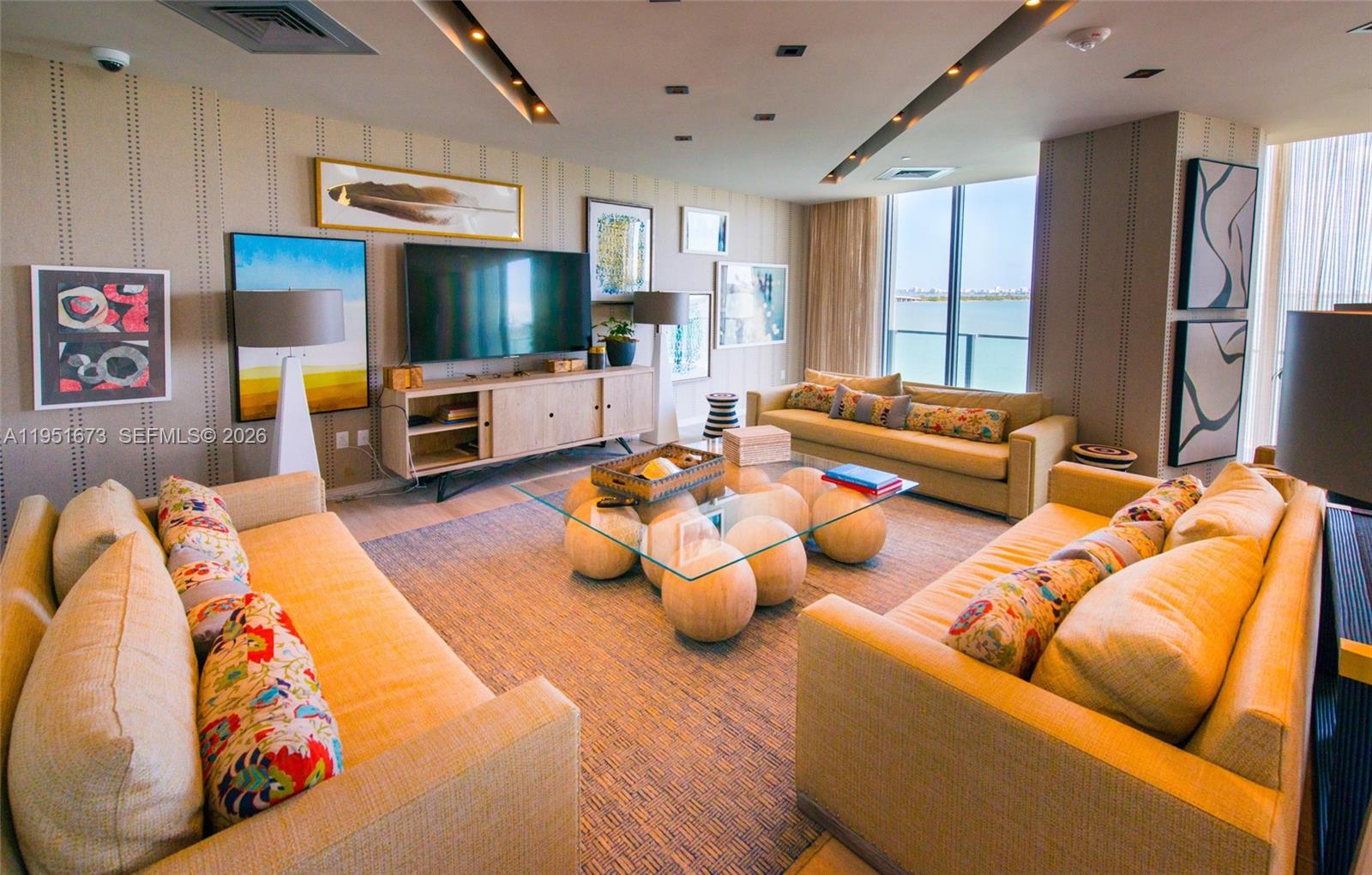 2900 Northeast 7th Avenue, Unit 1903 Miami, FL 33137 - Photo 27 of 43 a living room with furniture and a flat screen tv