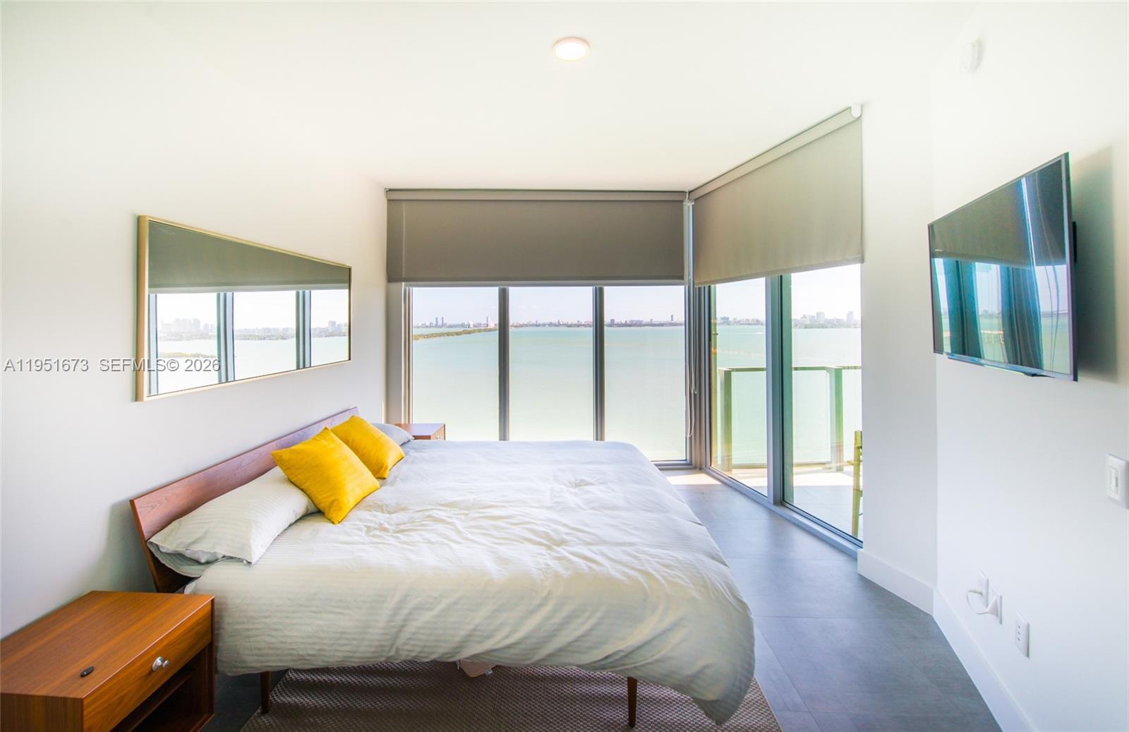 2900 Northeast 7th Avenue, Unit 1903 Miami, FL 33137 - Photo 3 of 43 a bedroom with a bed and wooden floor